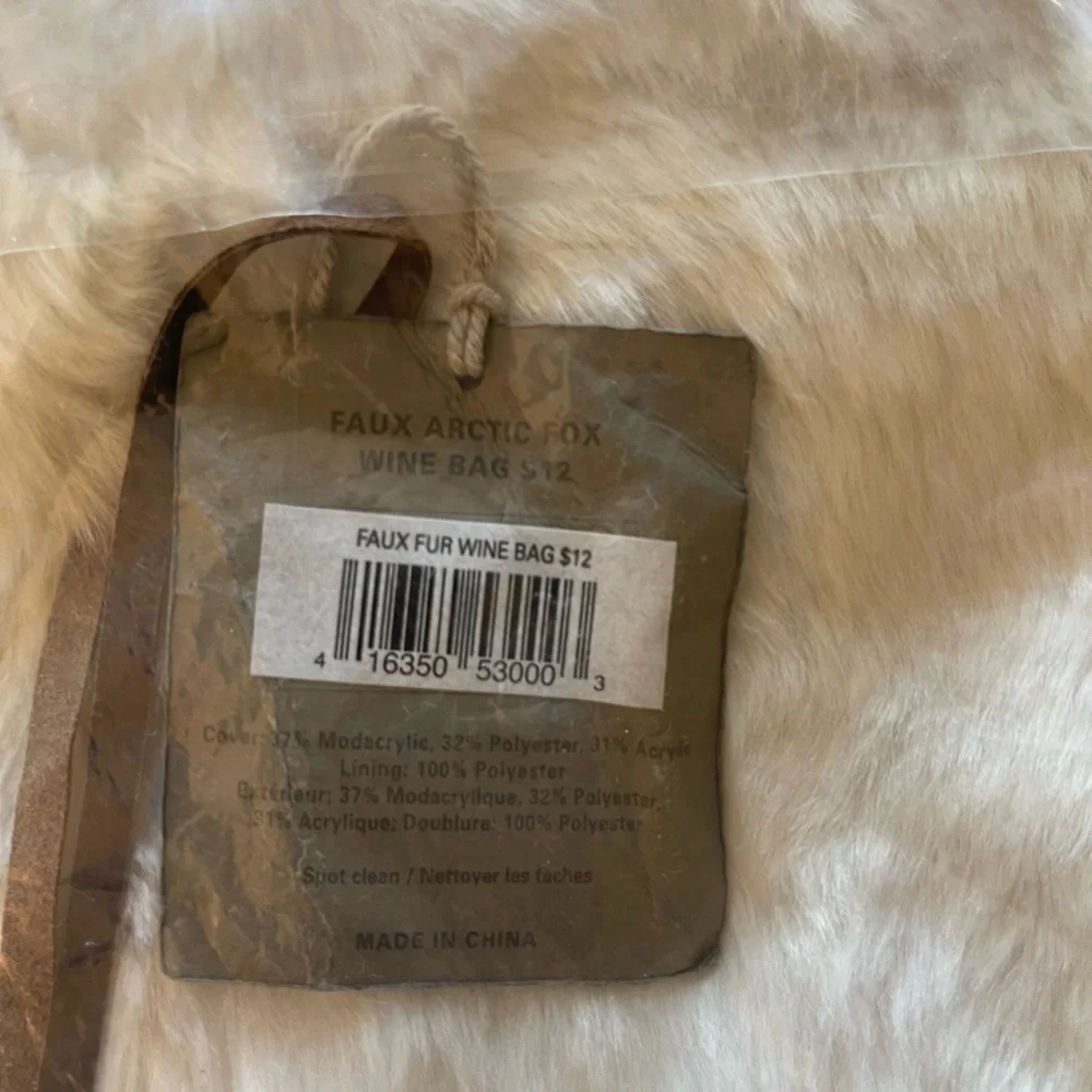 Pottery Barn Wine Bag in faux white fox Brand new and unused.